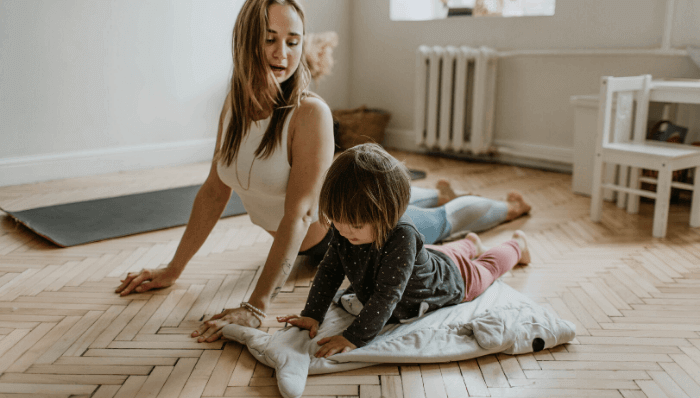 Mother and daughter exercising and doing yoga